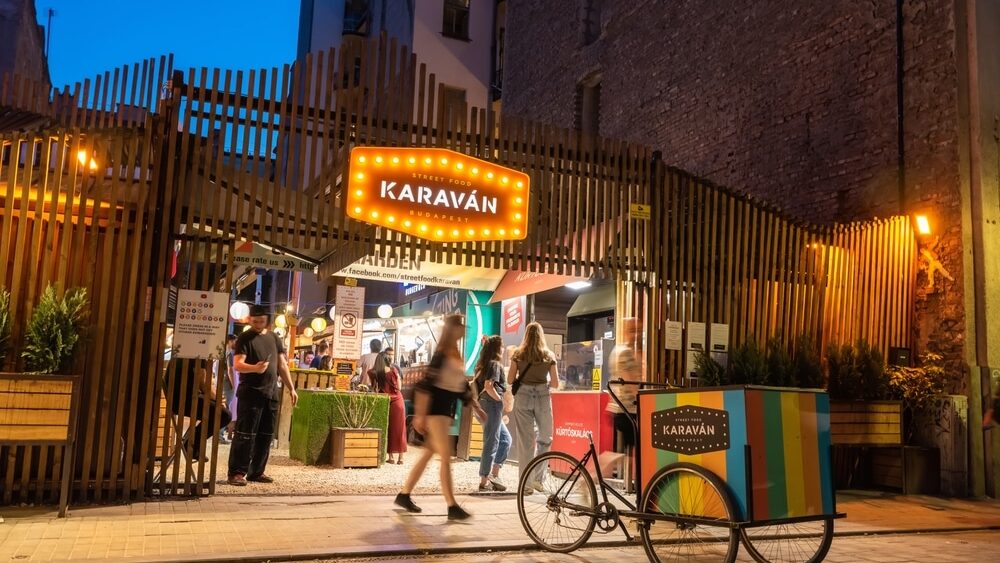 Budapest, Hungary – May 21, 2023. Karavan street food market in Budapest, Hungary. Located at Kazinczy utca 18 in Erzsebetvaros, this is a food court that gives home to numerous food trucks and booths