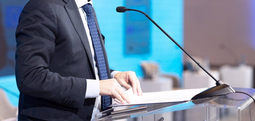 Speaker at business conference, corporate presentation, workshop, coaching training, news conference, company meeting, public or political event with copy space