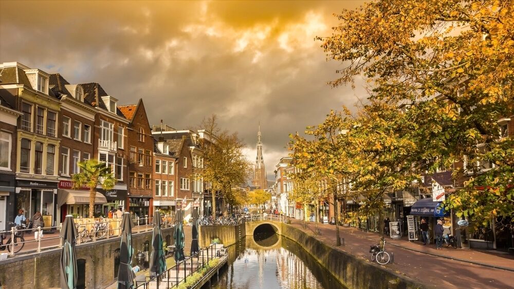 LEEUWARDEN, NETHERLANDS - OCTOBER 25, 2022: Autumn colors at the historic canals of Leeuwarden, Netherlands