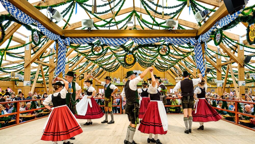 MUNICH, GERMANY - SEPTEMBER 21: people in the "traditon"-beer tent at the biggest folk festival in the world - the octoberfest on september 21, 2017 in munich.